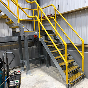 FRP modular handrail system on stairway in factory