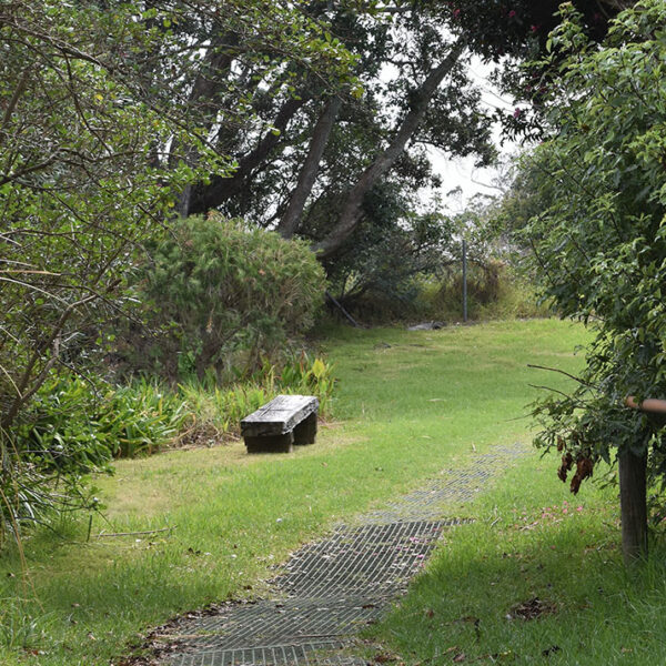 FRP green grating pathway in park space.