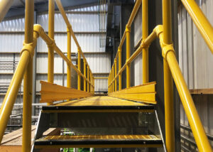 FRP Handrails and grating on a platform in a meat rendering factory.