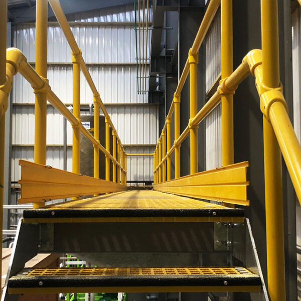 FRP Handrails and grating on a platform in a meat rendering factory.