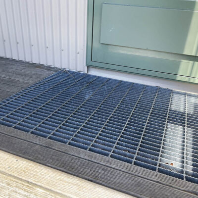 Steel grating on door step.