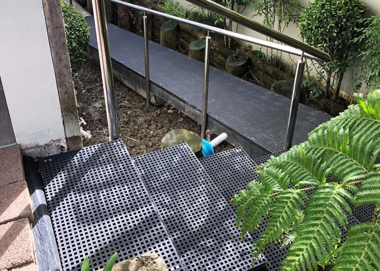 Black FRP mini mesh grating walkway outdoor stairs.