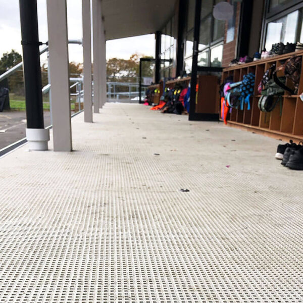 FRP micro mesh grating non-slip deck outside school classroom.