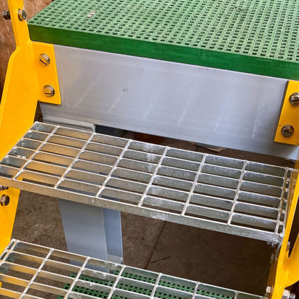 Steel grating stair platform in industrial factory.