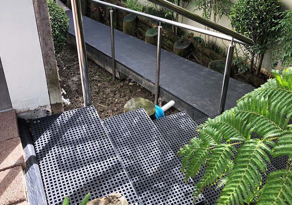 Black FRP mini mesh grating walkway outdoor stairs.