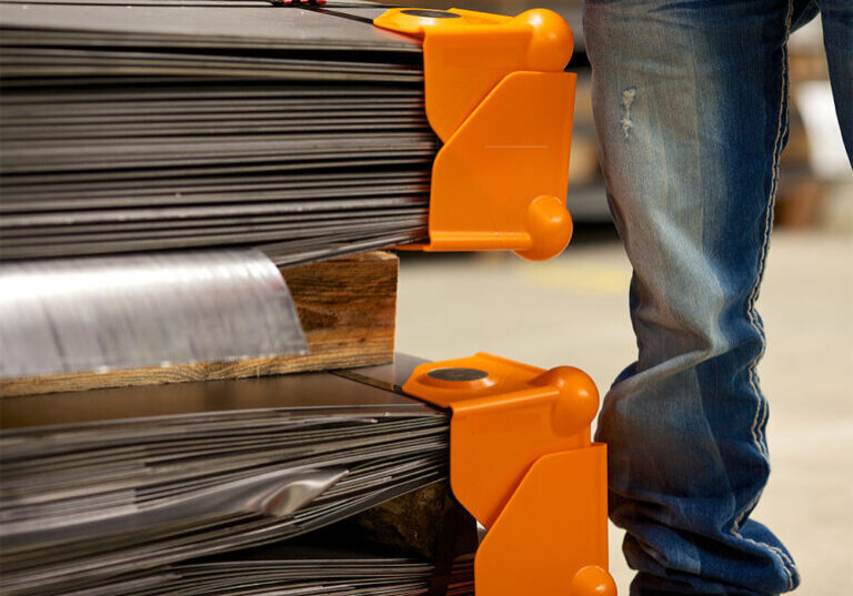 Orange sharp edge corner protection on steel sheets.