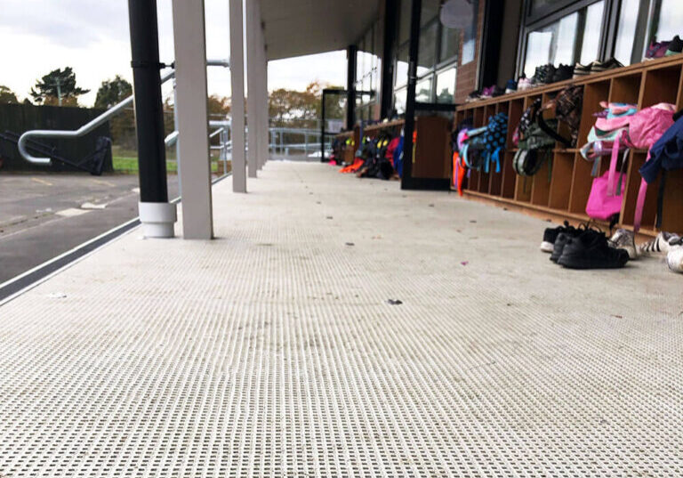FRP micro mesh grating non-slip deck outside school classroom.